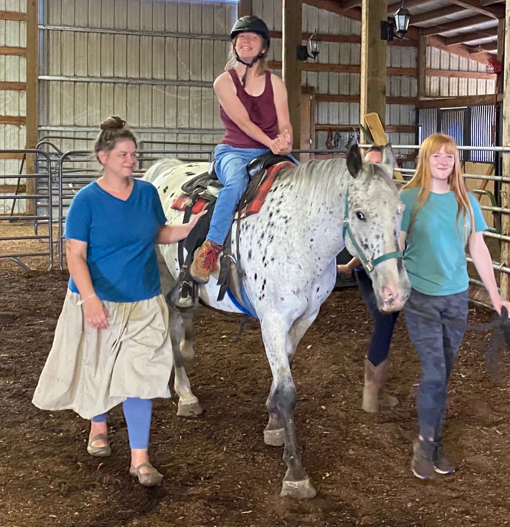 Children and instructors during a horseback riding lesson at Harmony Ranch